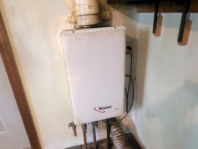 utility room with water heater