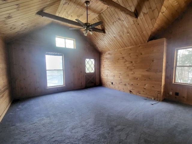 bonus room with wooden walls, ceiling fan, wooden ceiling, high vaulted ceiling, and carpet flooring