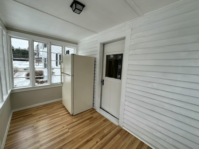 unfurnished sunroom featuring a healthy amount of sunlight