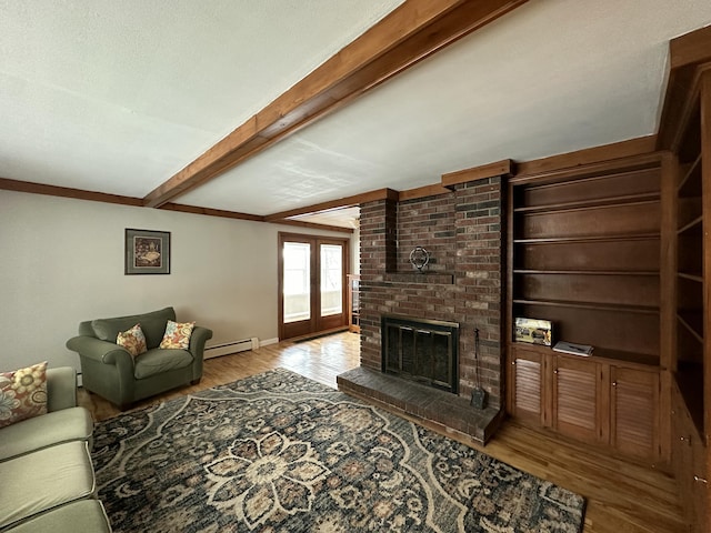 living room featuring beam ceiling, french doors, a brick fireplace, baseboard heating, and light hardwood / wood-style flooring