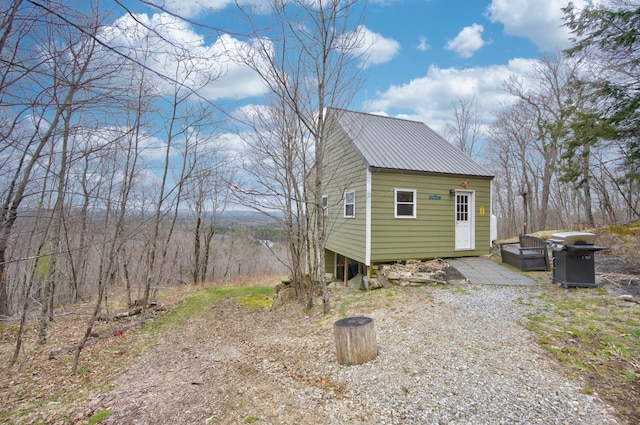 view of side of home with an outdoor structure