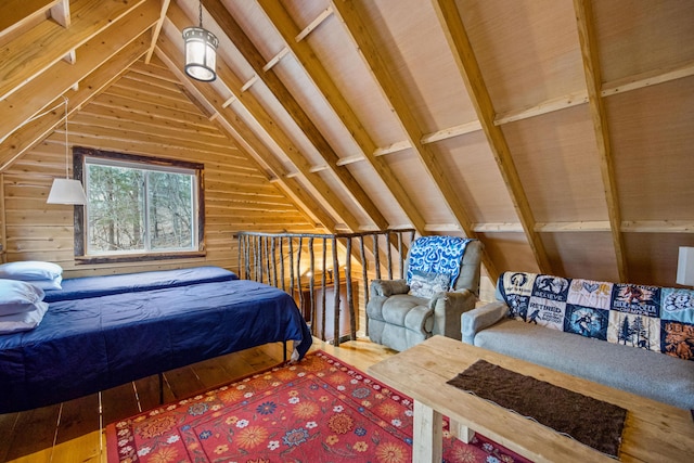 bedroom with lofted ceiling, wood walls, and hardwood / wood-style floors