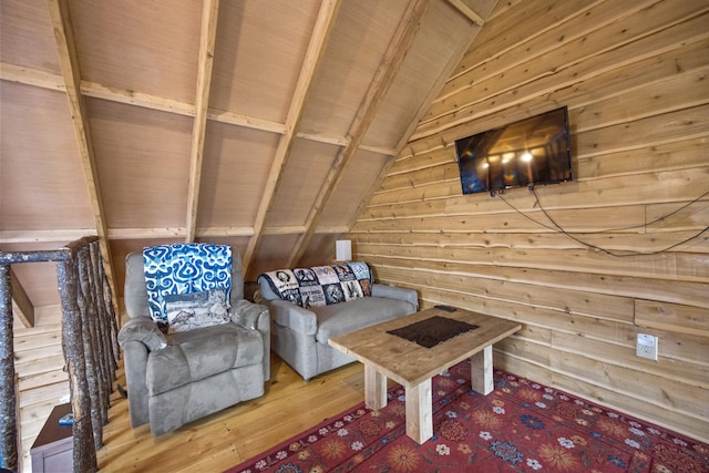 unfurnished room featuring wooden walls, hardwood / wood-style flooring, vaulted ceiling with beams, and wood ceiling