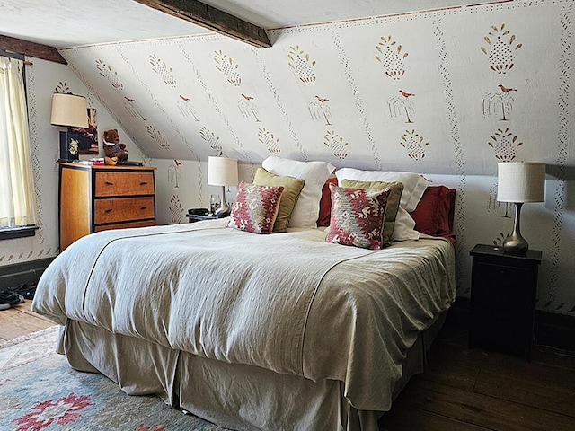 bedroom with lofted ceiling and hardwood / wood-style flooring