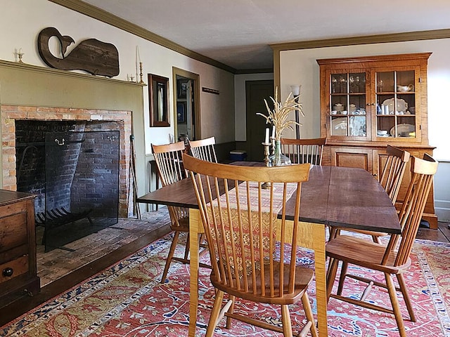 dining space with crown molding and wood-type flooring