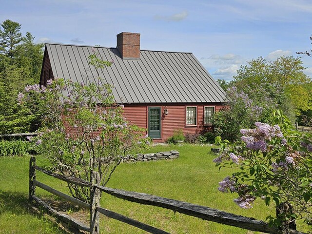 99 Angier Rd, Alna, ME 04535 - rear view of property with a standing seam roof, a chimney, and metal roof