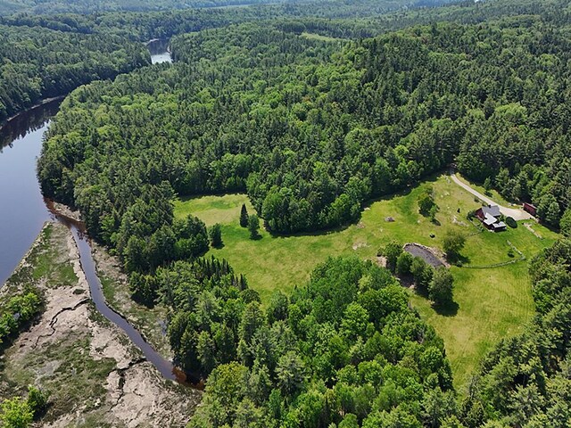 99 Angier Rd, Alna, ME 04535 - aerial view of property and surrounding area featuring a forest and a large body of water