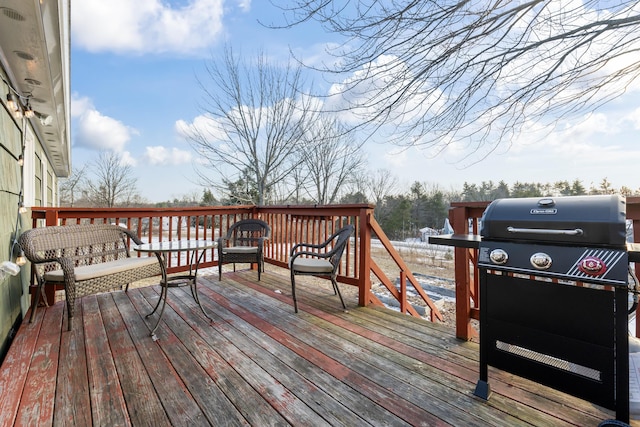 wooden deck featuring area for grilling