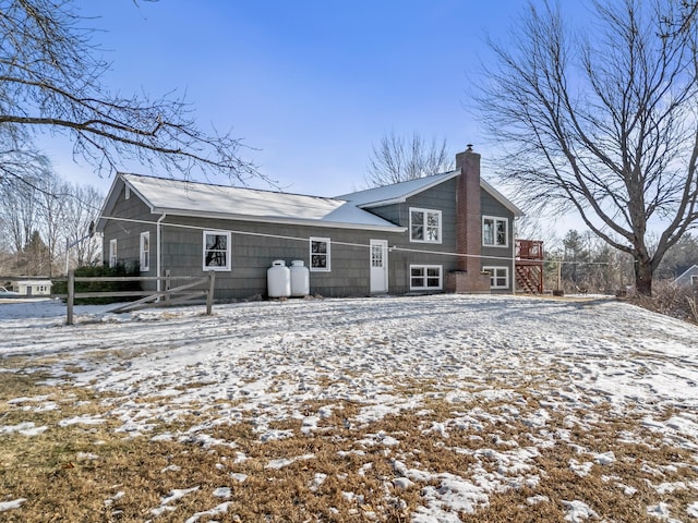 view of snow covered house