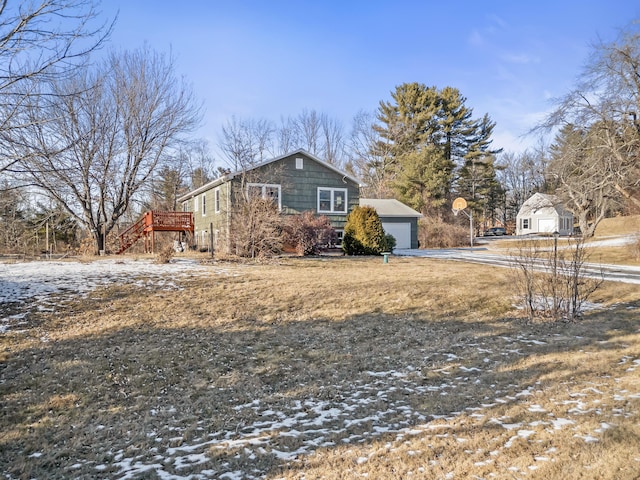 snow covered property featuring a garage