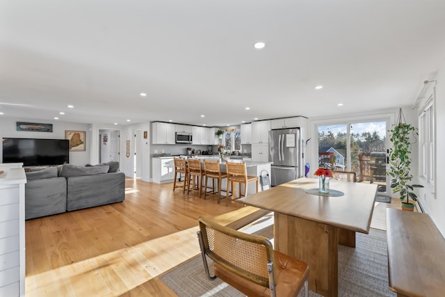 dining room with light hardwood / wood-style flooring