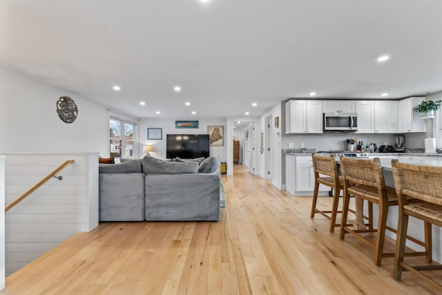 living room with light hardwood / wood-style flooring