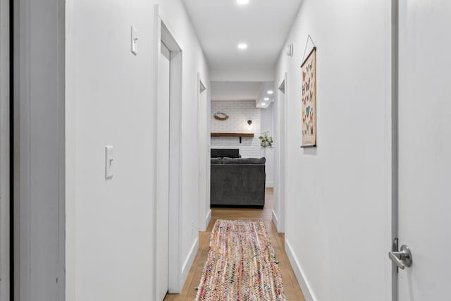 hallway with light wood-type flooring