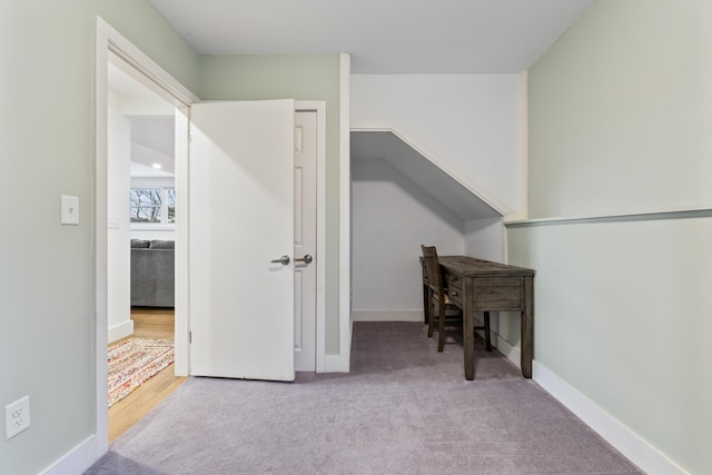 interior space featuring light colored carpet