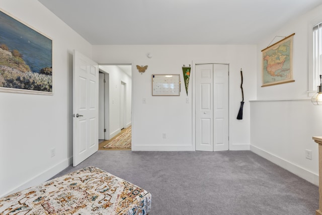 carpeted bedroom featuring a closet