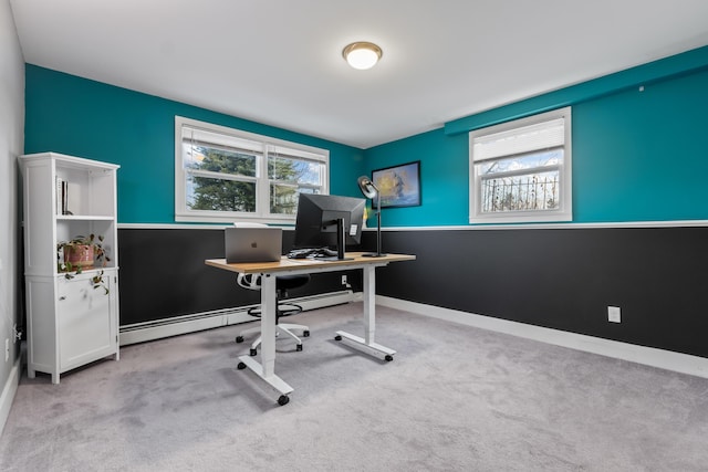 carpeted office space with a healthy amount of sunlight and baseboard heating