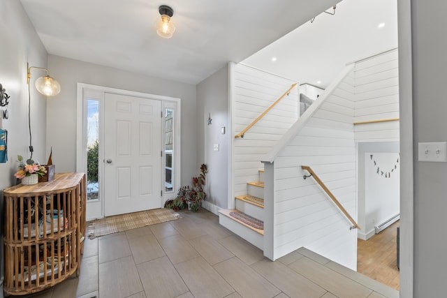 foyer entrance with a baseboard radiator