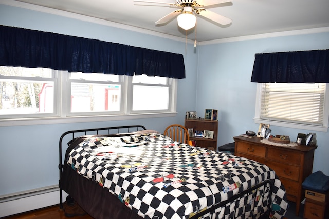 bedroom with ceiling fan, dark wood-type flooring, crown molding, and a baseboard heating unit