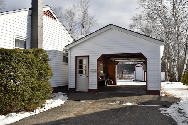 view of snow covered garage