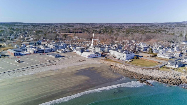 birds eye view of property featuring a water view and a view of the beach