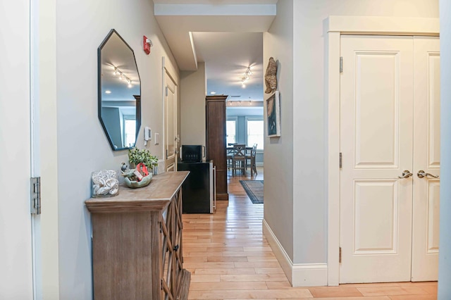 corridor featuring light hardwood / wood-style flooring