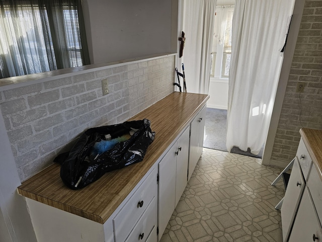 kitchen featuring white cabinets