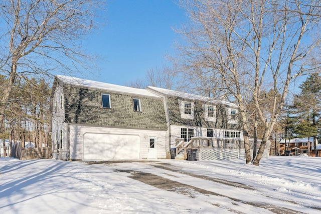 view of front facade featuring a garage and a deck