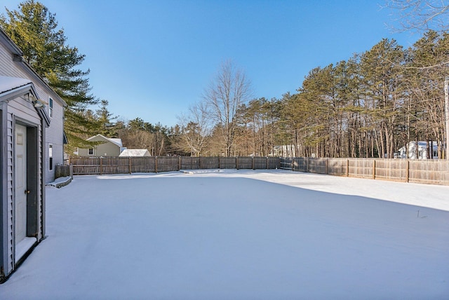 view of yard layered in snow