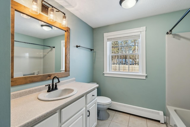 bathroom with vanity, tile patterned floors, baseboard heating, and toilet