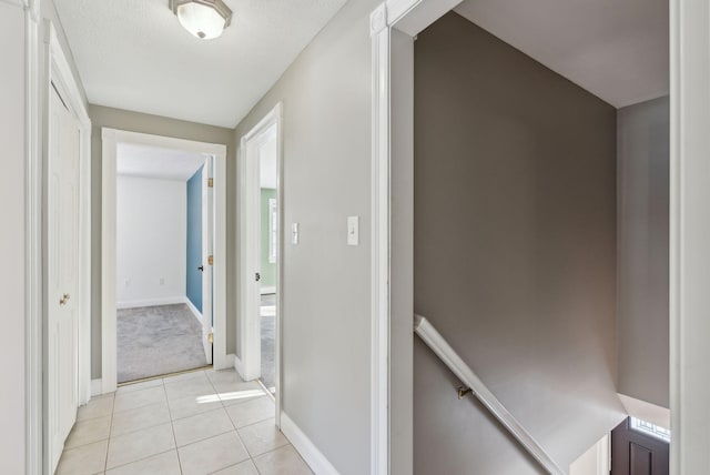 corridor with light tile patterned flooring