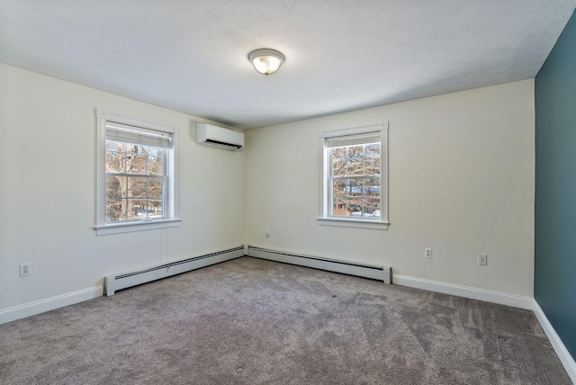 carpeted empty room featuring a wall mounted air conditioner, a textured ceiling, and a baseboard heating unit