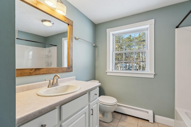 bathroom with tile patterned flooring, a baseboard radiator, vanity, and toilet