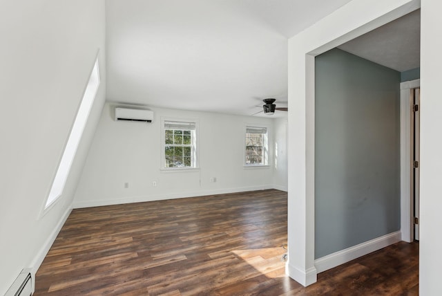 spare room featuring a baseboard radiator, an AC wall unit, ceiling fan, and dark hardwood / wood-style flooring