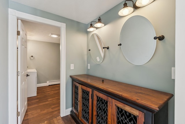 bathroom featuring a baseboard radiator and wood-type flooring