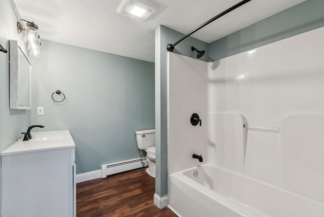 full bathroom featuring wood-type flooring, vanity, baseboard heating, tub / shower combination, and a textured ceiling