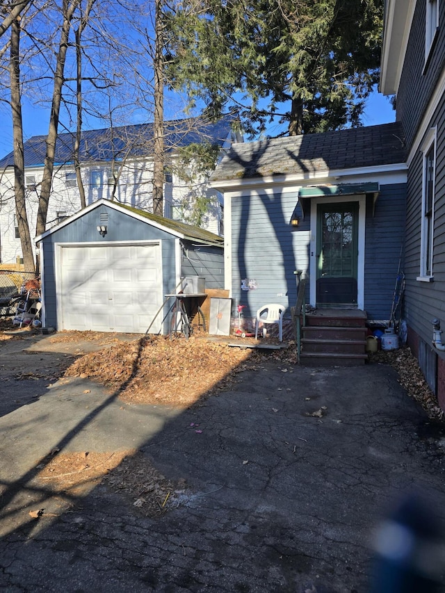 exterior space featuring an outdoor structure and a garage