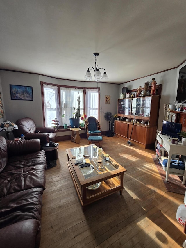 living room featuring a chandelier and hardwood / wood-style floors