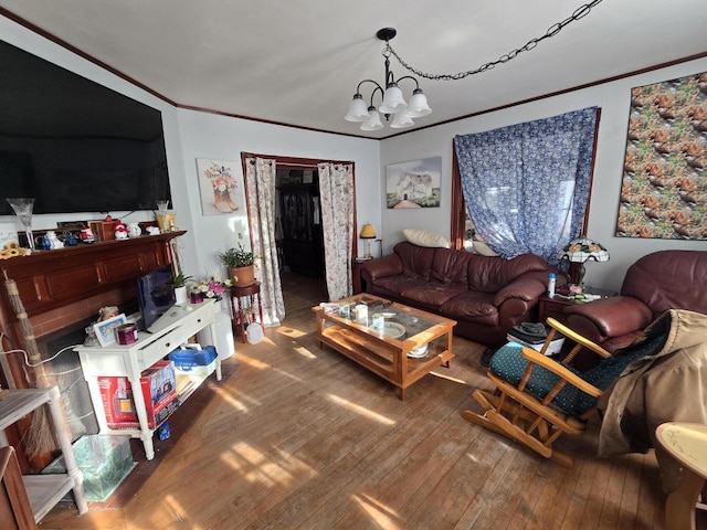 living room with wood-type flooring and an inviting chandelier