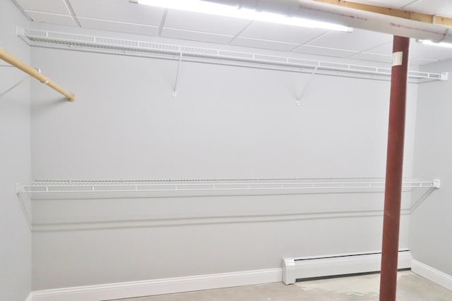 spacious closet featuring a baseboard heating unit