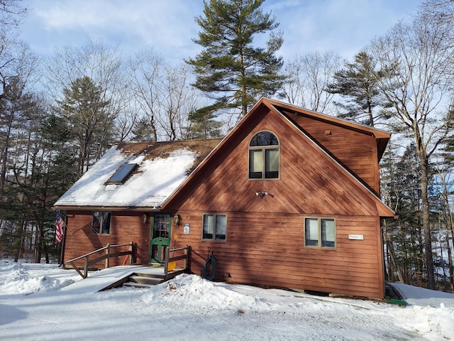 view of snow covered house