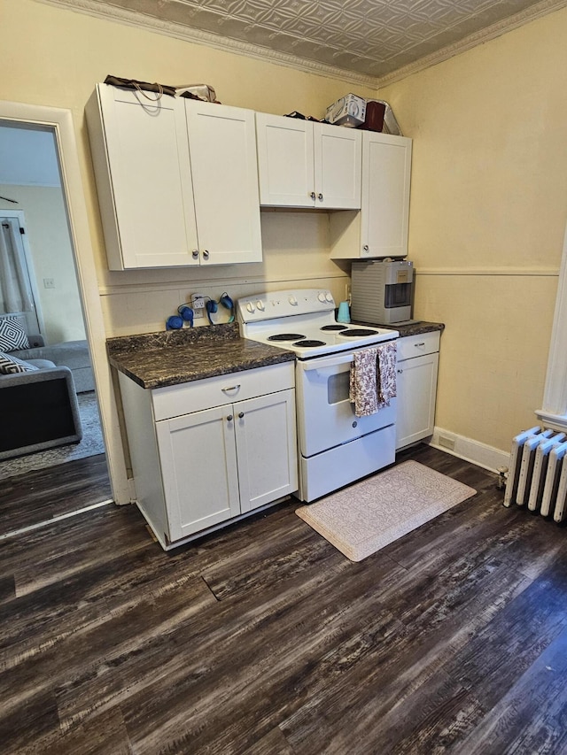 kitchen featuring white range with electric cooktop, dark hardwood / wood-style flooring, and white cabinets