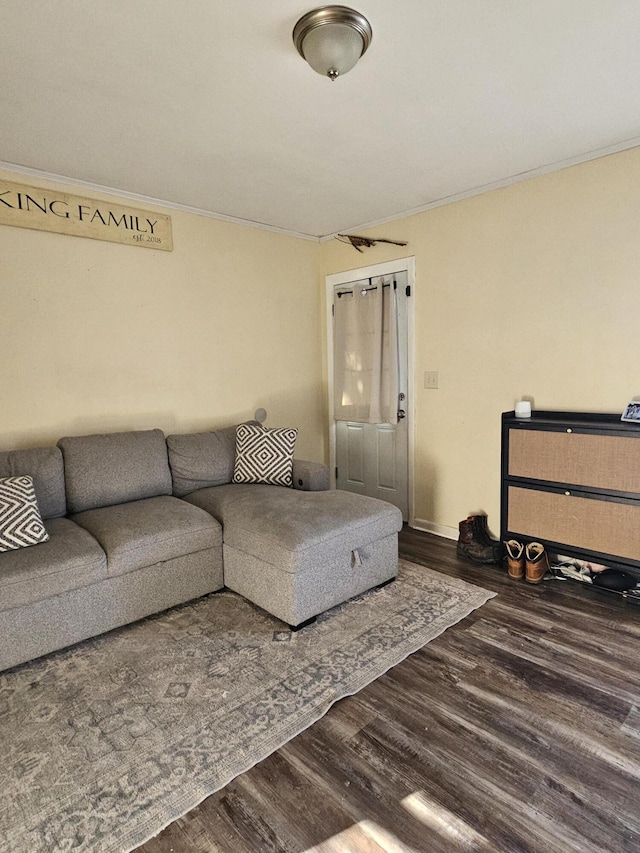 living room with ornamental molding and hardwood / wood-style floors