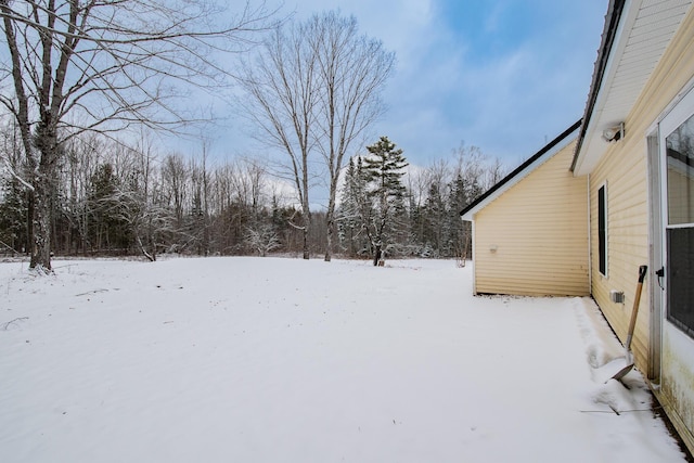 view of yard layered in snow