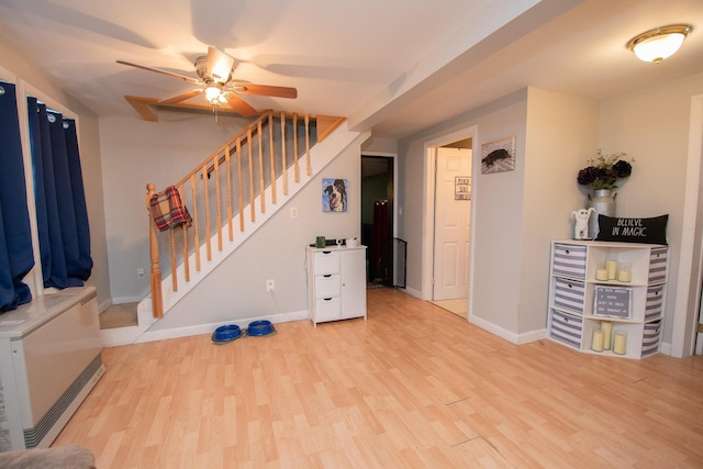 foyer featuring ceiling fan and light hardwood / wood-style floors