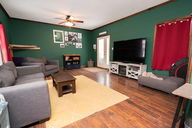 living room with ceiling fan, wood-type flooring, and crown molding