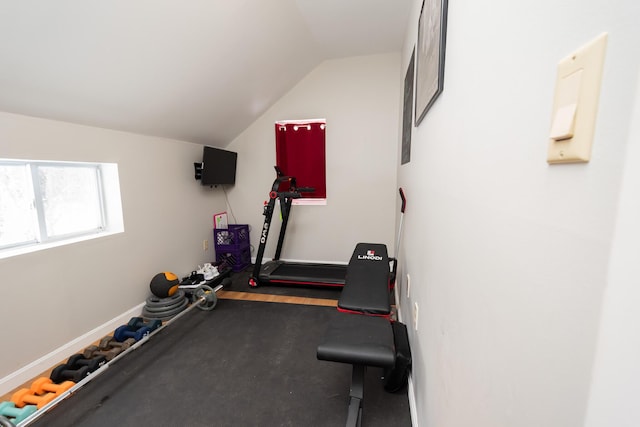 exercise room featuring lofted ceiling