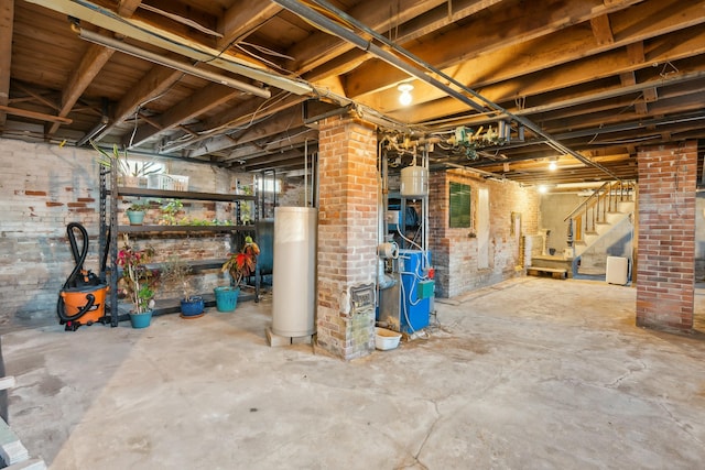 basement with brick wall and water heater