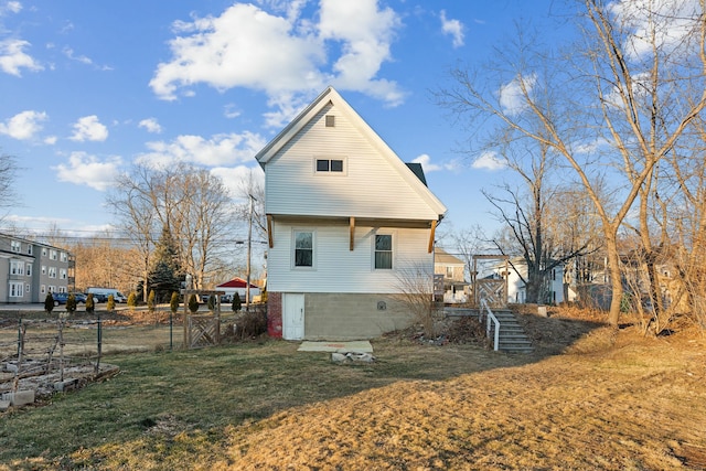 view of property exterior with a lawn