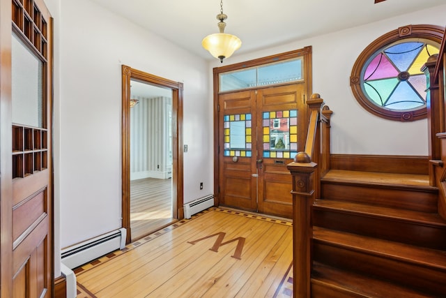 foyer featuring french doors, a baseboard radiator, and light hardwood / wood-style flooring