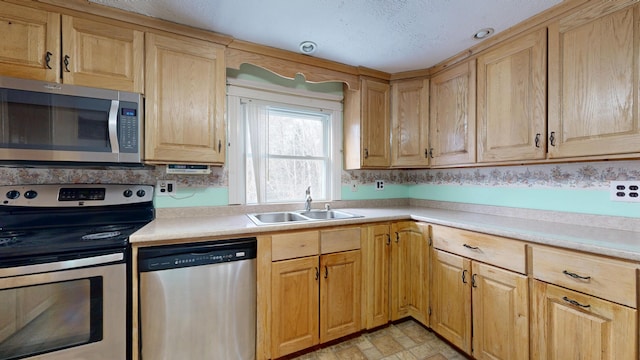 kitchen featuring appliances with stainless steel finishes and sink